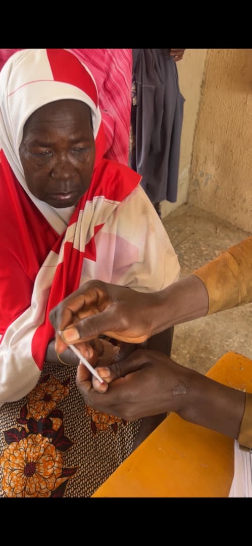 A community member receiving a health screening